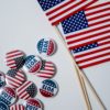 american flags and pins on white background